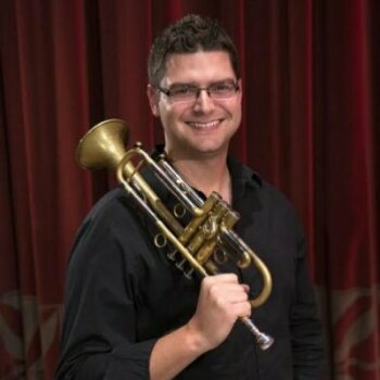 Matthew Anklan holding trumpet